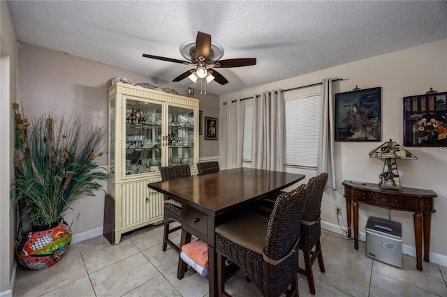 6519 W Newberry Rd Unit 108, Gainesville, FL 32605 - dining room with ceiling fan, light tile patterned floors, a textured ceiling, and baseboards