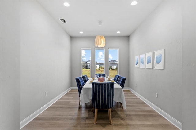 11903 SW 31st Rd, Gainesville, FL 32608 - dining room featuring recessed lighting, light wood-style flooring, and baseboards