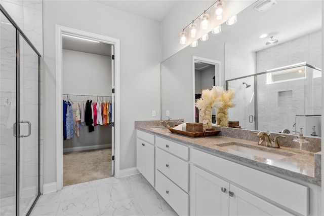 11903 SW 31st Rd, Gainesville, FL 32608 - full bath featuring marble finish flooring, double vanity, a stall shower, baseboards, and a walk in closet