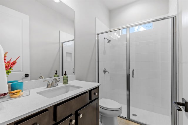 bathroom with walk in shower, tile patterned flooring, vanity, and toilet