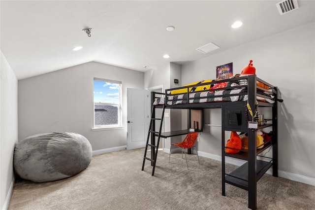 bedroom with carpet and vaulted ceiling