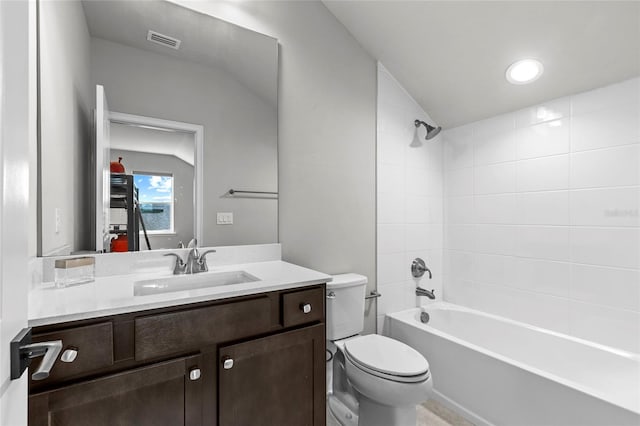 11903 SW 31st Rd, Gainesville, FL 32608 - bathroom featuring toilet, vanity, tub / shower combination, and lofted ceiling