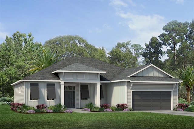 view of front of house with a garage and a front lawn