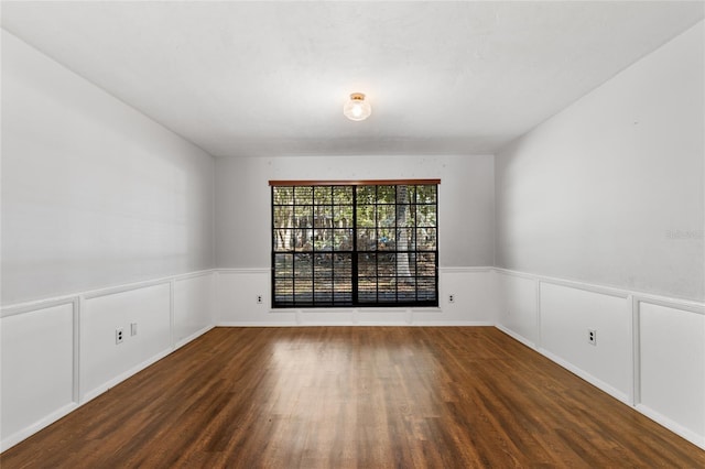 empty room featuring dark hardwood / wood-style flooring