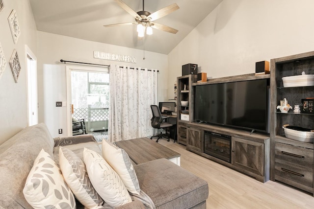 living room featuring ceiling fan, high vaulted ceiling, and light hardwood / wood-style flooring