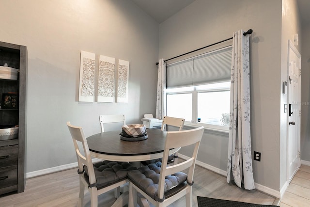 dining space featuring light hardwood / wood-style floors