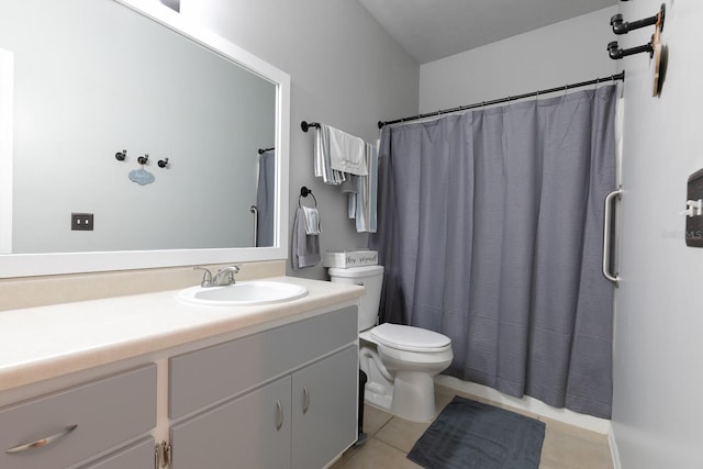 bathroom featuring tile patterned floors, vanity, curtained shower, and toilet