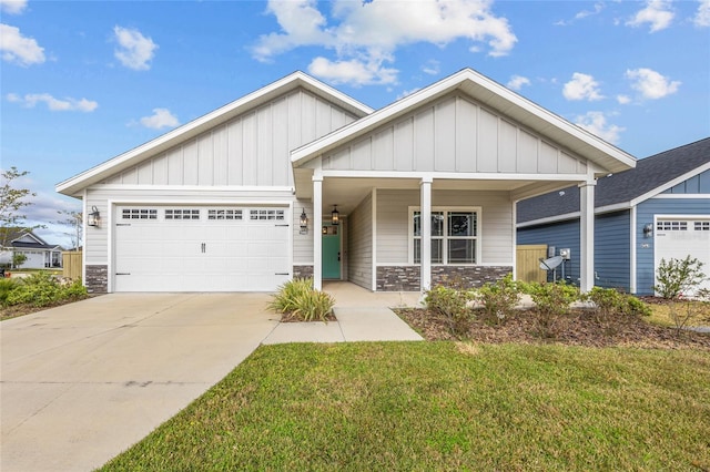 craftsman-style house with a front yard and a garage