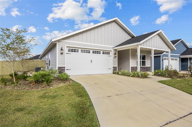 craftsman-style house with a garage, a front lawn, and cooling unit