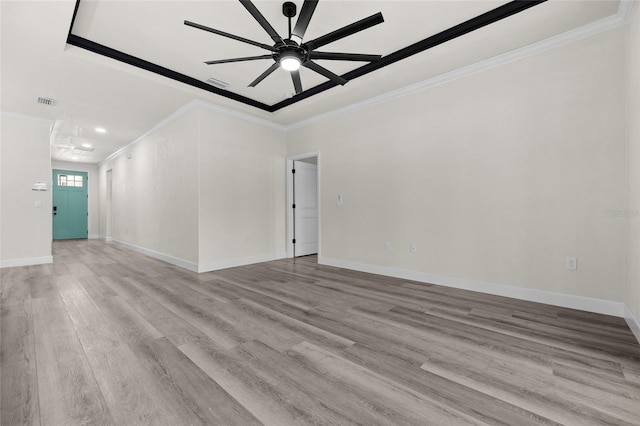 unfurnished room featuring ceiling fan, light hardwood / wood-style flooring, and ornamental molding