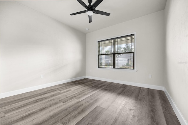 unfurnished room featuring hardwood / wood-style floors and ceiling fan