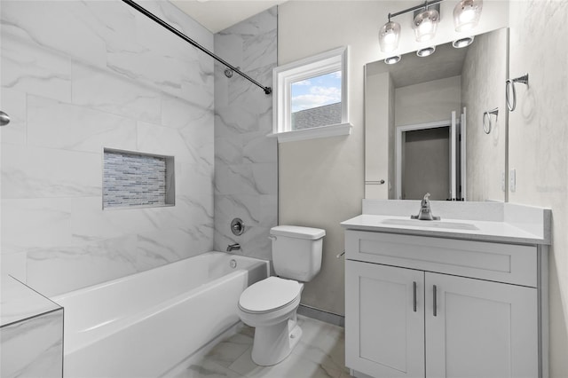 full bathroom featuring tiled shower / bath combo, toilet, and vanity