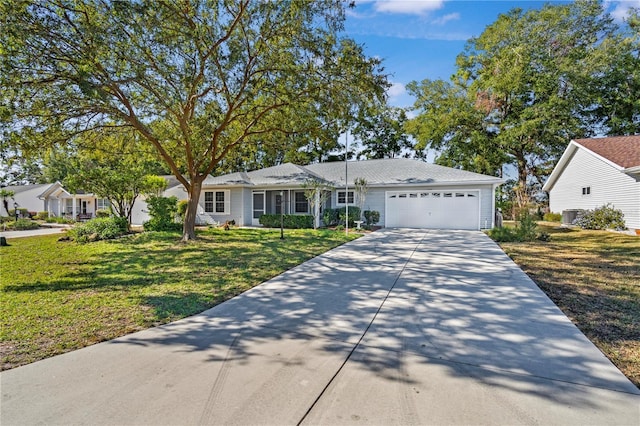 ranch-style house featuring a front lawn and a garage