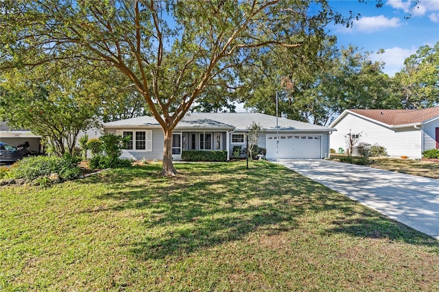 single story home featuring a front lawn and a garage