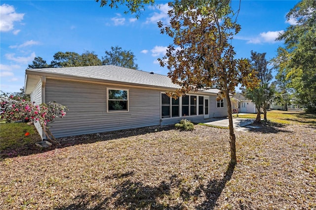 rear view of property featuring a patio area