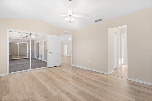 unfurnished bedroom with light hardwood / wood-style flooring, ceiling fan, and lofted ceiling