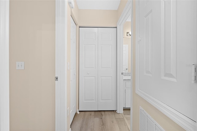 corridor featuring light hardwood / wood-style floors