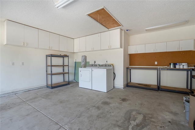 garage with washing machine and clothes dryer