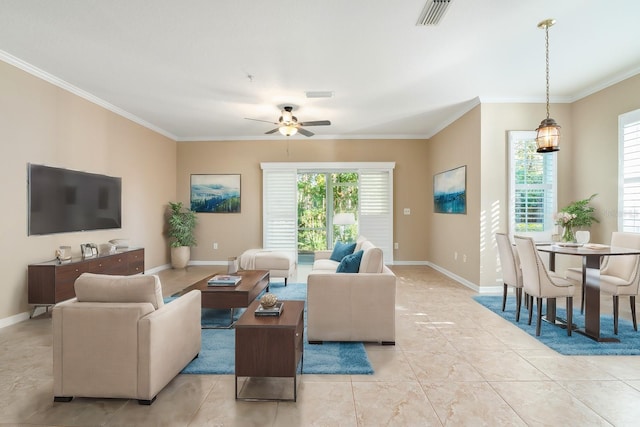 living room featuring ceiling fan, light tile patterned floors, and ornamental molding