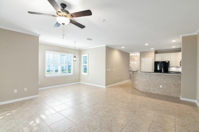 unfurnished living room with ceiling fan, light tile patterned flooring, and crown molding