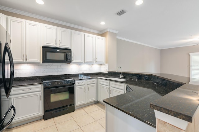 kitchen with kitchen peninsula, sink, white cabinets, and black appliances