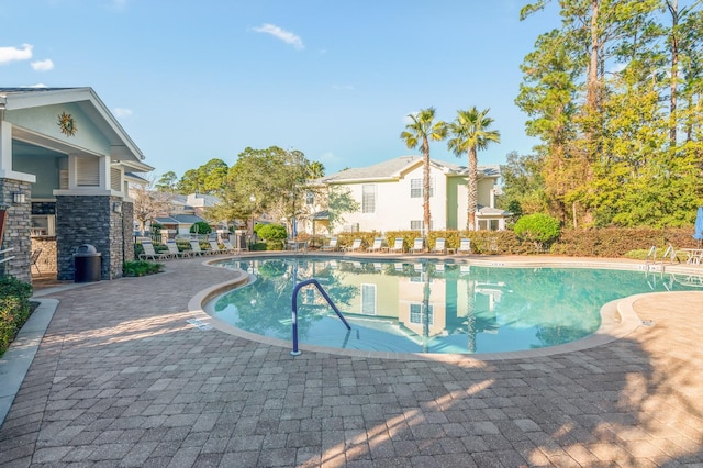 view of swimming pool featuring a patio