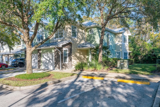 multi unit property featuring stone siding and stucco siding