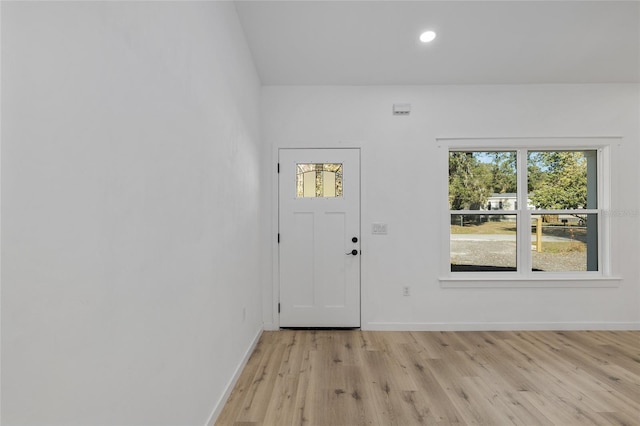 foyer entrance with light wood-type flooring