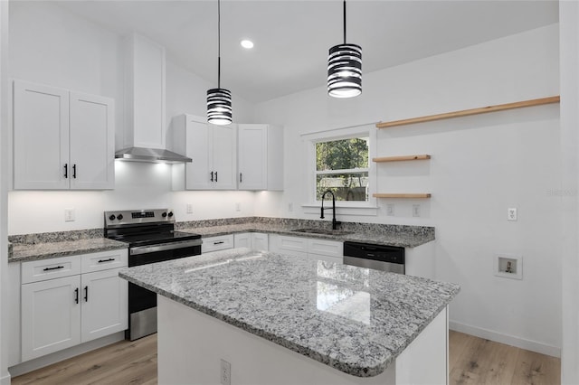 kitchen with white cabinets, decorative light fixtures, and sink