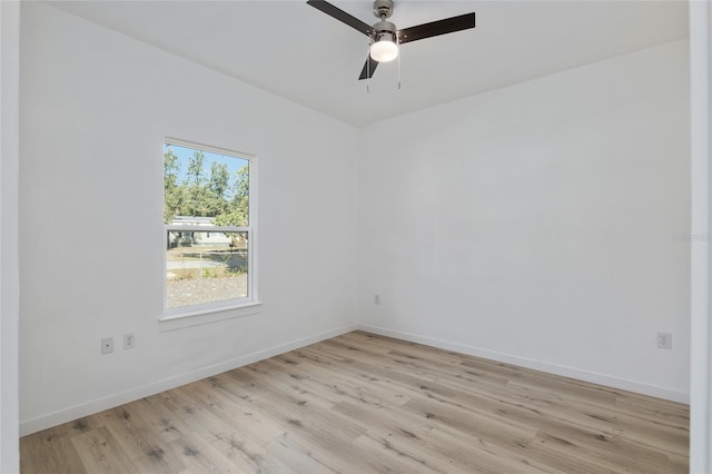 empty room featuring ceiling fan and light wood-type flooring