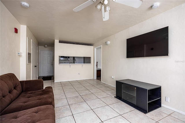 4000 SW 23rd St Unit 5-207, Gainesville, FL 32608 - living area with light tile patterned floors and ceiling fan
