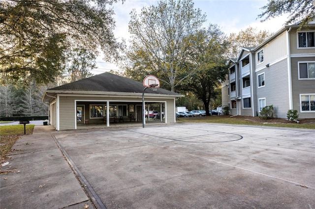 exterior space with basketball court