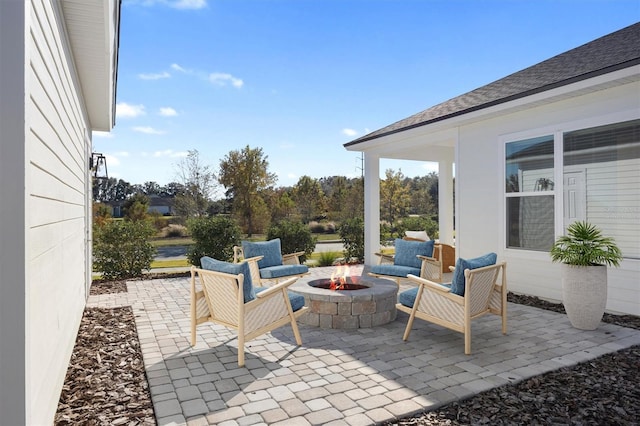 view of patio / terrace with an outdoor fire pit