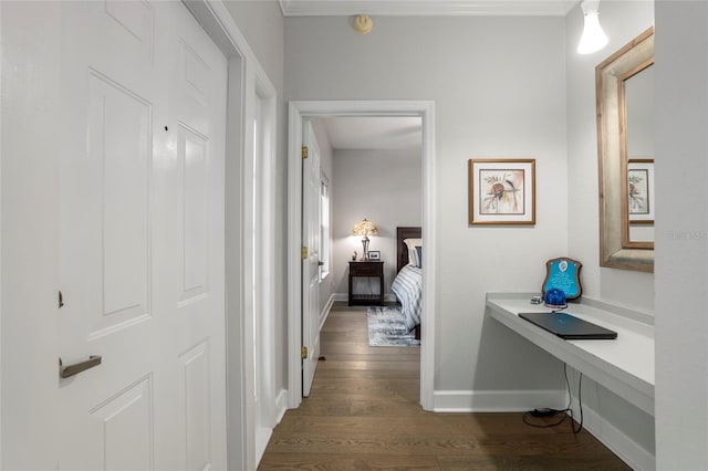 corridor with dark hardwood / wood-style flooring