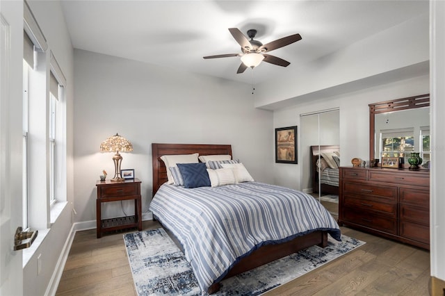 bedroom featuring hardwood / wood-style flooring and ceiling fan