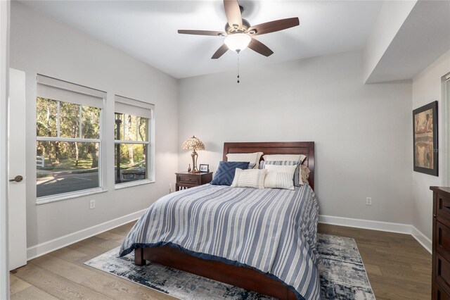 bedroom featuring hardwood / wood-style flooring and ceiling fan