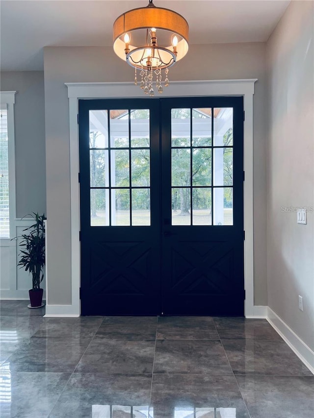 entryway featuring a chandelier