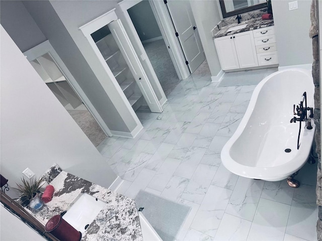 bathroom with vanity and a bathtub