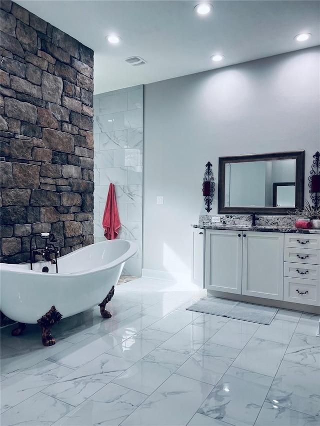 bathroom featuring vanity and a bathing tub