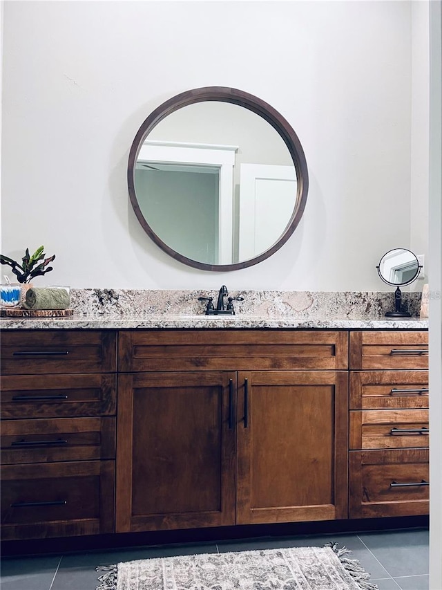 bathroom with tile patterned flooring and vanity