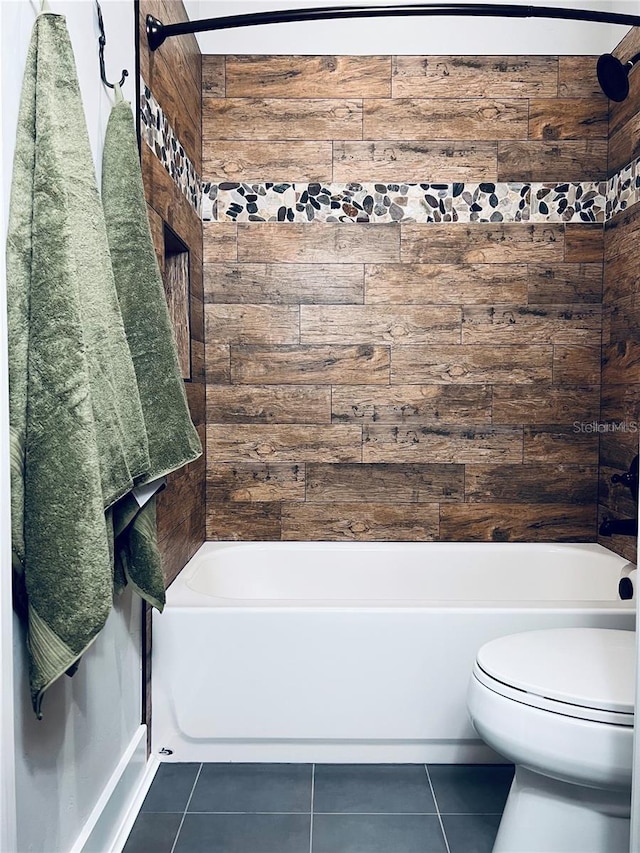 bathroom featuring tile patterned flooring and toilet