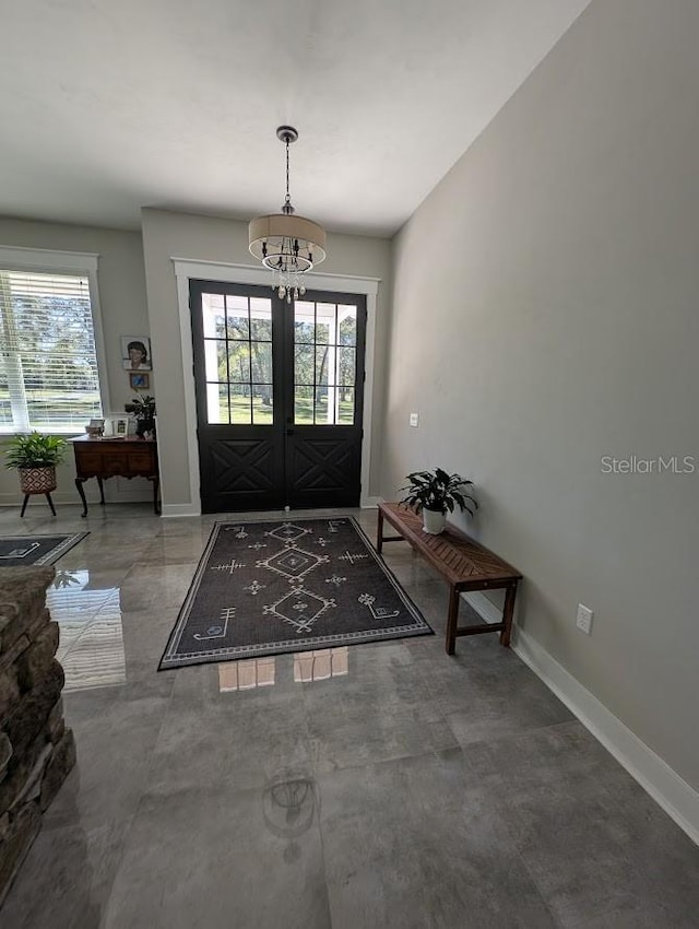 entrance foyer with a chandelier