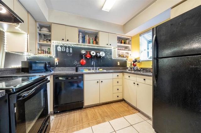 kitchen featuring black appliances, backsplash, sink, and cream cabinets