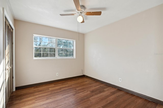 unfurnished bedroom featuring a closet, dark hardwood / wood-style floors, and ceiling fan