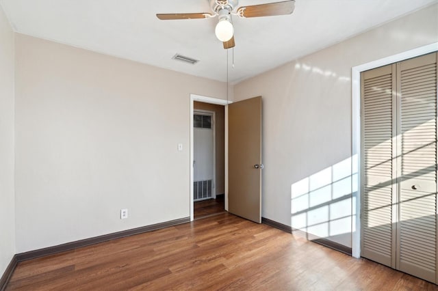 spare room featuring ceiling fan and hardwood / wood-style floors