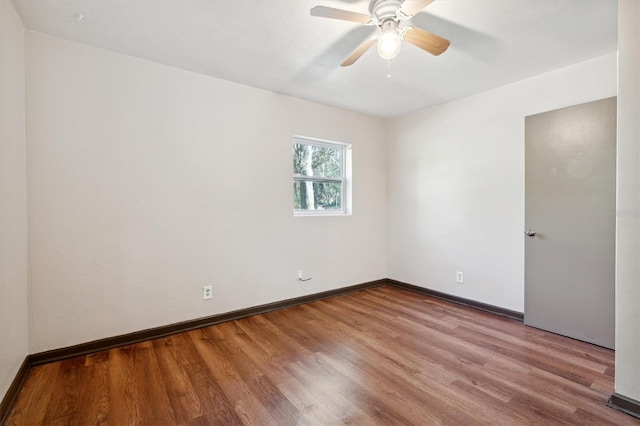 unfurnished room with ceiling fan and wood-type flooring