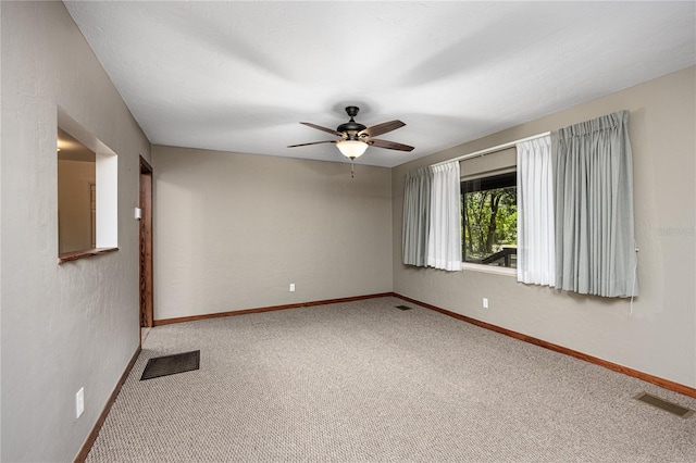 carpeted empty room with ceiling fan