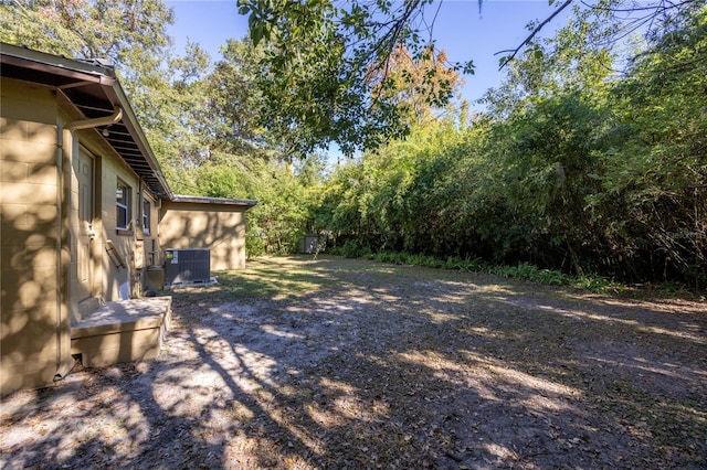 view of yard with central AC