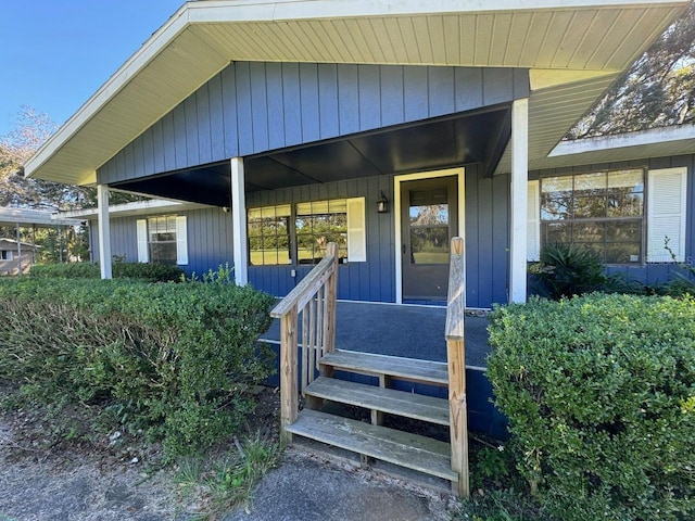 property entrance with covered porch