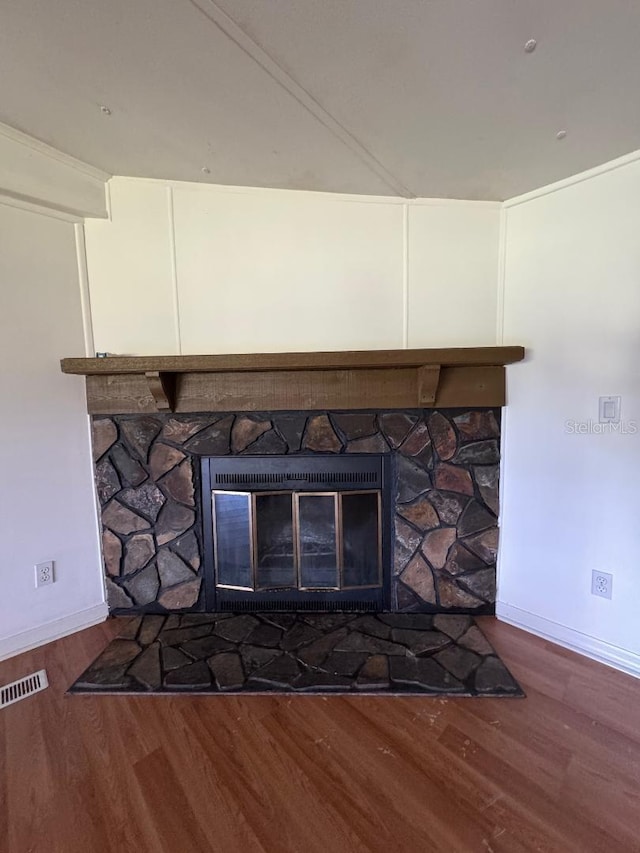 room details with a fireplace and hardwood / wood-style floors